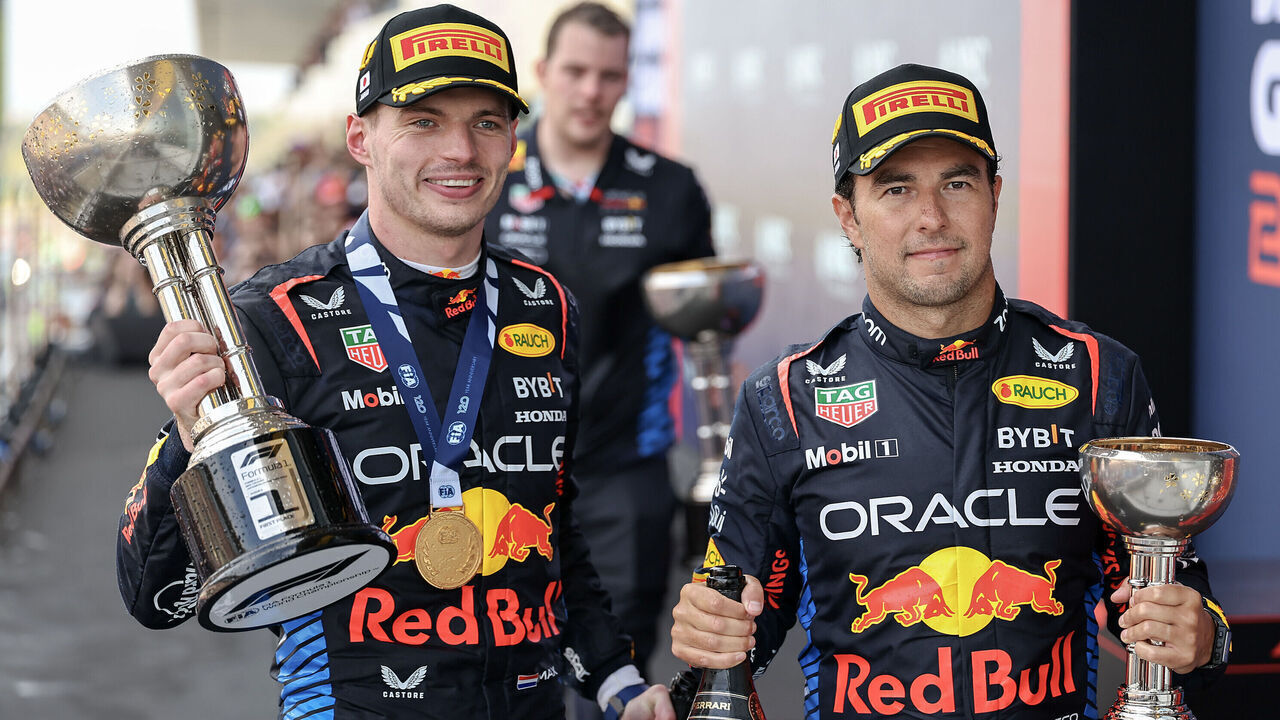 SUZUKA, JAPAN - APRIL 7: Max Verstappen of the Netherlands and Oracle Red Bull Racing and Sergio Perez of Mexico and Oracle Red Bull Racing on the podium during the F1 Grand Prix of Japan at Suzuka International Racing Course on April 7, 2024 in Suzuka, Japan.