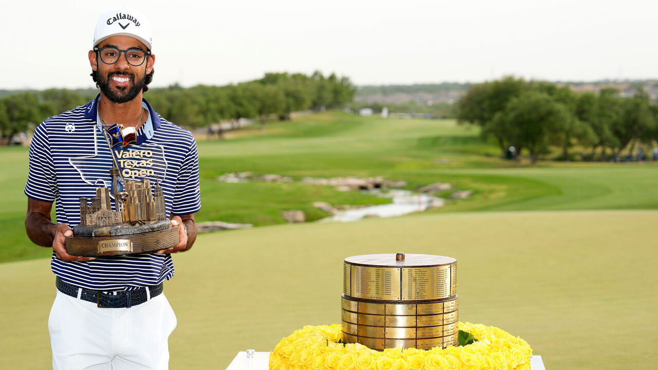 SAN ANTONIO, TEXAS - APRIL 07: Akshay Bhatia of the United States poses with the trophy after winning the Valero Texas Open on the 18th hole of the first playoff during the final round of the Valero Texas Open at TPC San Antonio on April 07, 2024 in San Antonio, Texas.