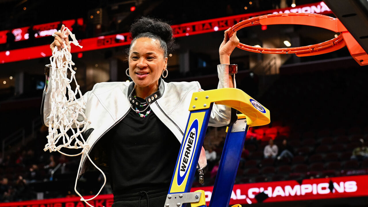 CLEVELAND, OH - APRIL 7: Head coach Dawn Staley of the South Carolina Gamecocks cuts down the net after defeating the Iowa Hawkeyes 87-75 at the 2024 NCAA Women's Basketball Tournament championship game between Iowa and South Carolina at Rocket Mortgage FieldHouse on April 7, 2024 in Cleveland, Ohio.