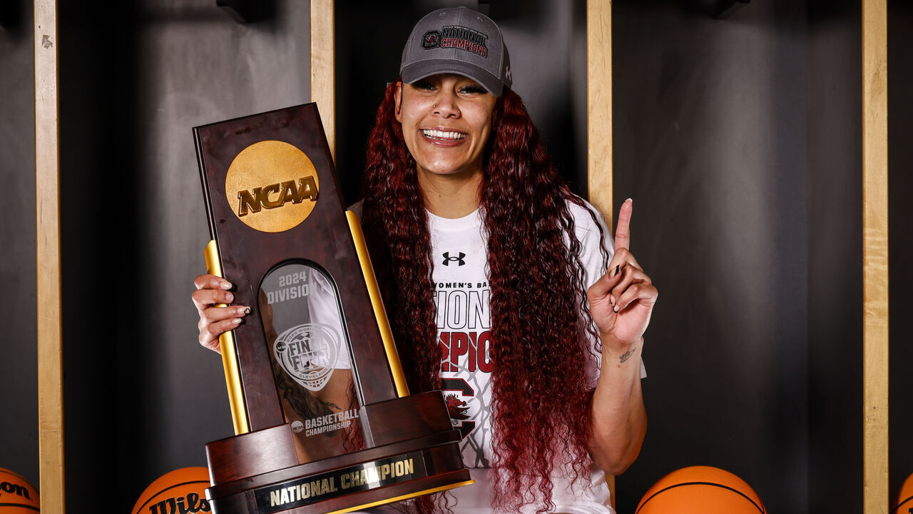 CLEVELAND, OHIO - APRIL 07: Kamilla Cardoso #10 of the South Carolina Gamecocks poses with the trophy after defeating the Iowa Hawkeyes during the NCAA Women's Basketball Tournament Final Four semifinal game at Rocket Mortgage Fieldhouse on April 7, 2024 in Cleveland, Ohio.