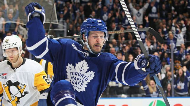 TORONTO, CANADA - APRIL 8: Jake McCabe #22 of the Toronto Maple Leafs celebrates his overtime winning goal against the Pittsburgh Penguins at Scotiabank Arena on April 8, 2024 in Toronto, Ontario, Canada. The Maple Leafs defeated the Penguins 3-2 in overtime.