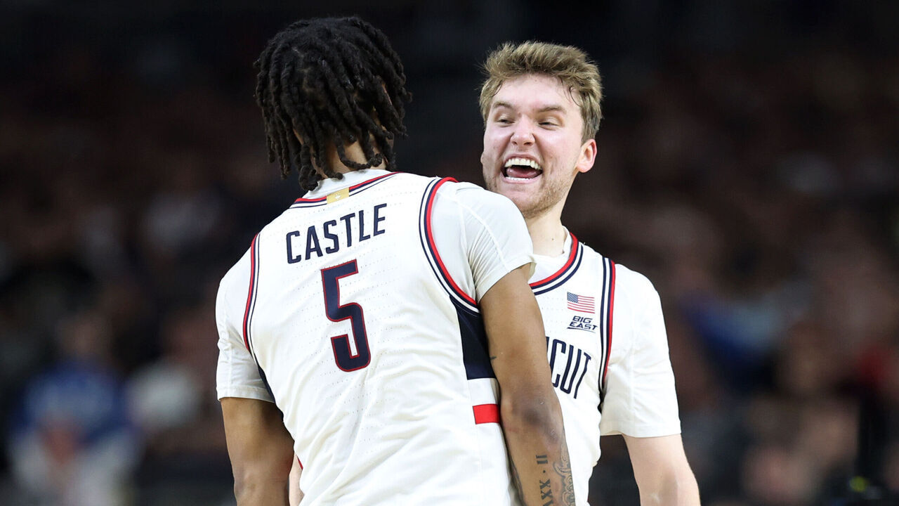 GLENDALE, ARIZONA - APRIL 08: Stephon Castle #5 and Cam Spencer #12 of the Connecticut Huskies celebrate in the second half against the Purdue Boilermakers during the NCAA Men's Basketball Tournament National Championship game at State Farm Stadium on April 08, 2024 in Glendale, Arizona.