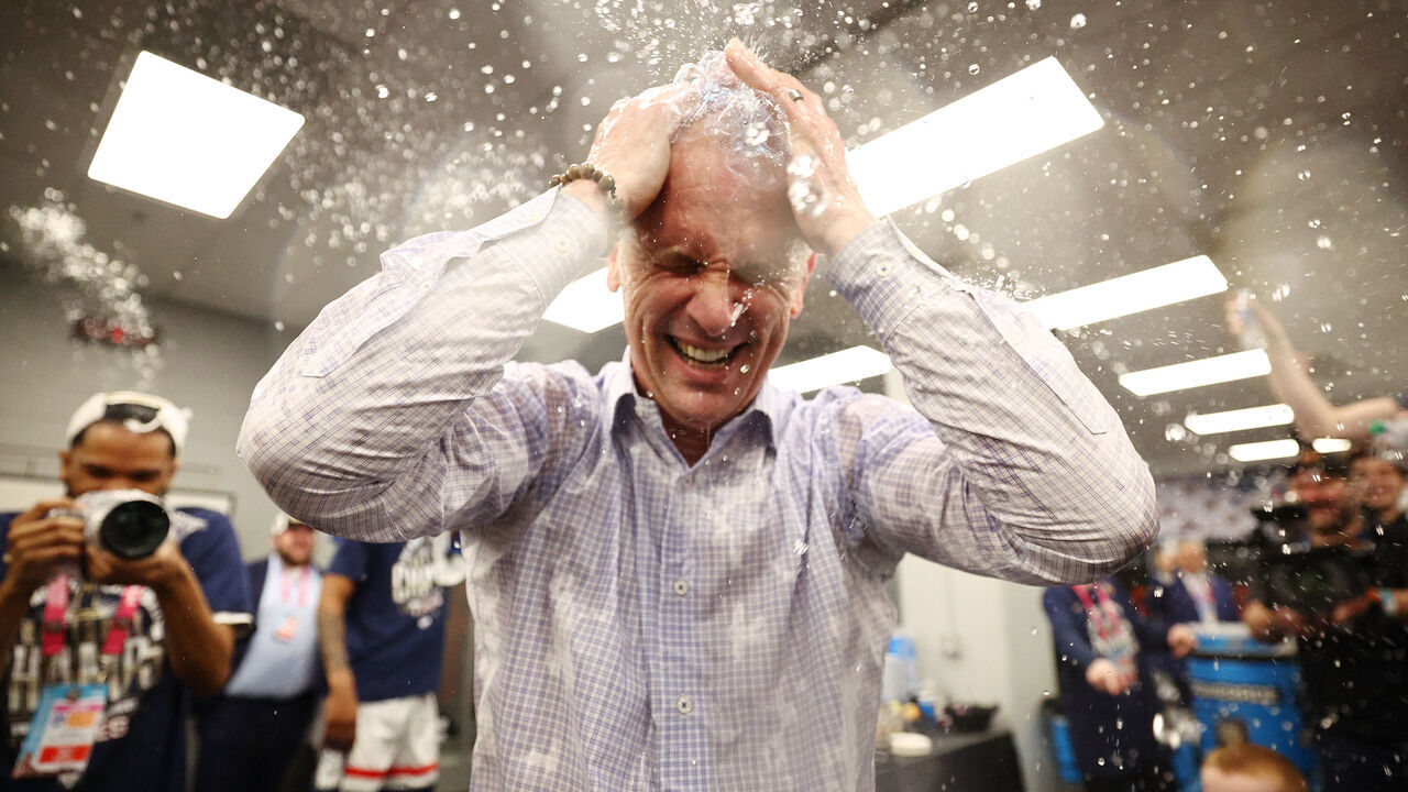 GLENDALE, ARIZONA - APRIL 08: head coach Dan Hurley of the Connecticut Huskies celebrates after defeating the Purdue Boilermakers in the NCAA Men's Basketball Tournament National Championship game at State Farm Stadium on April 08, 2024 in Glendale, Arizona.