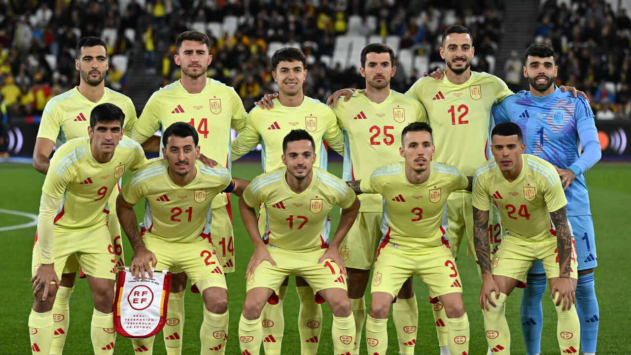 (Back L-R) Spain's midfielder #06 Mikel Merino, Spain's defender #14 Aymeric Laporte, Spain's midfielder #04 Martin Zubimendi, Spain's defender #25 Daniel Vivian, Spain's striker #12 Joselu, Spain's goalkeeper #01 David Raya, (L-R) Spain's striker #09 Gerard Moreno, Spain's midfielder Mikel Oyarzabal #21, Spain's striker #17 Pablo Sarabia, Spain's defender #03 Alejandro Grimaldo and Spain's defender #24 Pedro Porro pose for a group picture before the international friendly football match between Spain and Colombia at The London Stadium in east London on March 22, 2024.