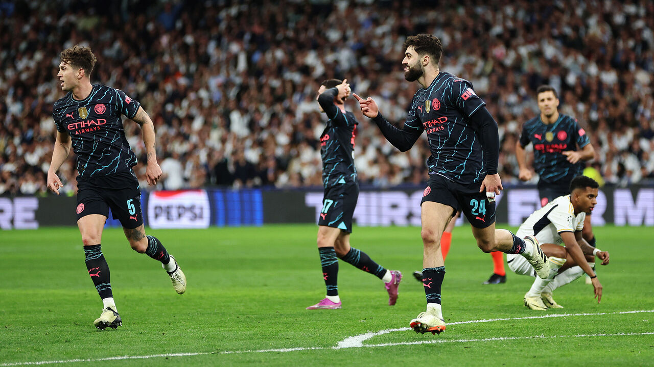 MADRID, SPAIN - APRIL 09: Josko Gvardiol of Manchester City celebrates scoring his team's third goal during the UEFA Champions League quarter-final first leg match between Real Madrid CF and Manchester City at Estadio Santiago Bernabeu on April 09, 2024 in Madrid, Spain.