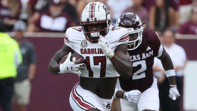 COLLEGE STATION, TEXAS - OCTOBER 28: Xavier Legette #17 of the South Carolina Gamecocks runs with the ball after a catch as Demani Richardson #26 of the Texas A&M Aggies is unable to make the tackle during the second half at Kyle Field on October 28, 2023 in College Station, Texas.