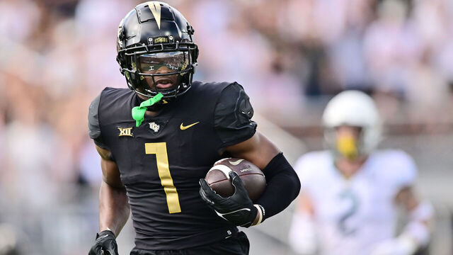 ORLANDO, FLORIDA - SEPTEMBER 30: Javon Baker #1 of the UCF Knights catches a 65-yard touchdown pass in the first quarter against the Baylor Bears at FBC Mortgage Stadium on September 30, 2023 in Orlando, Florida.