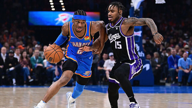 OKLAHOMA CITY, OKLAHOMA - APRIL 9: Shai Gilgeous-Alexander #2 of the Oklahoma City Thunder drives against Davion Mitchell #15 of the Sacramento Kings during the first half at Paycom Center on April 9, 2024 in Oklahoma City, Oklahoma.