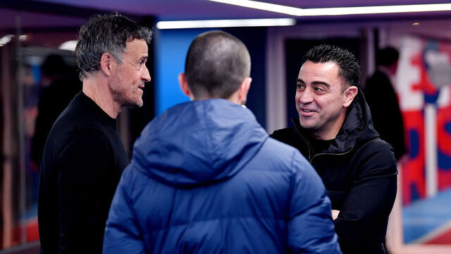 PARIS, FRANCE - APRIL 10: Luis Enrique, Head Coach of Paris Saint-Germain, and Xavi, Head Coach of FC Barcelona, interact prior to the UEFA Champions League quarter-final first leg match between Paris Saint-Germain and FC Barcelona at Parc des Princes on April 10, 2024 in Paris, France.