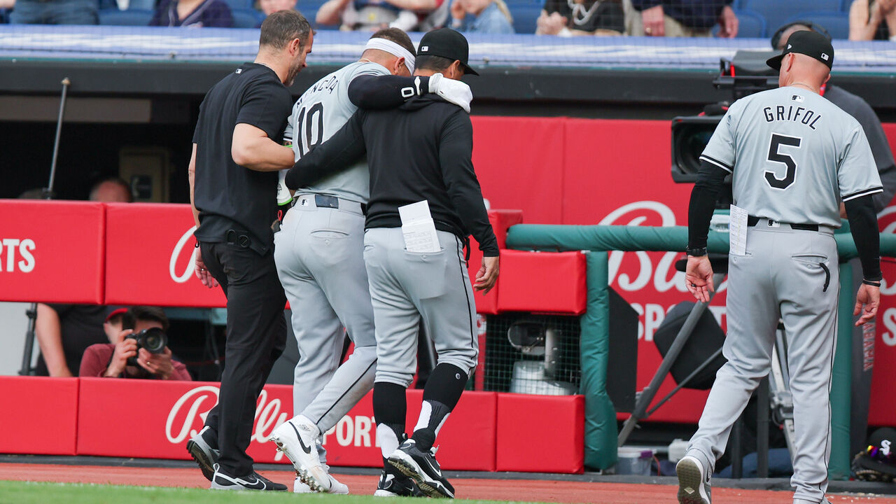 CLEVELAND, OH - APRIL 09: Chicago White Sox third baseman Yoan Moncada (10) is helped to the dugout as he leaves the game with a left adductor strain after grounding out to third base during the second inning of the Major League Baseball game between the Chicago White Sox and Cleveland Guardians on April 9, 2024, at Progressive Field in Cleveland, OH.