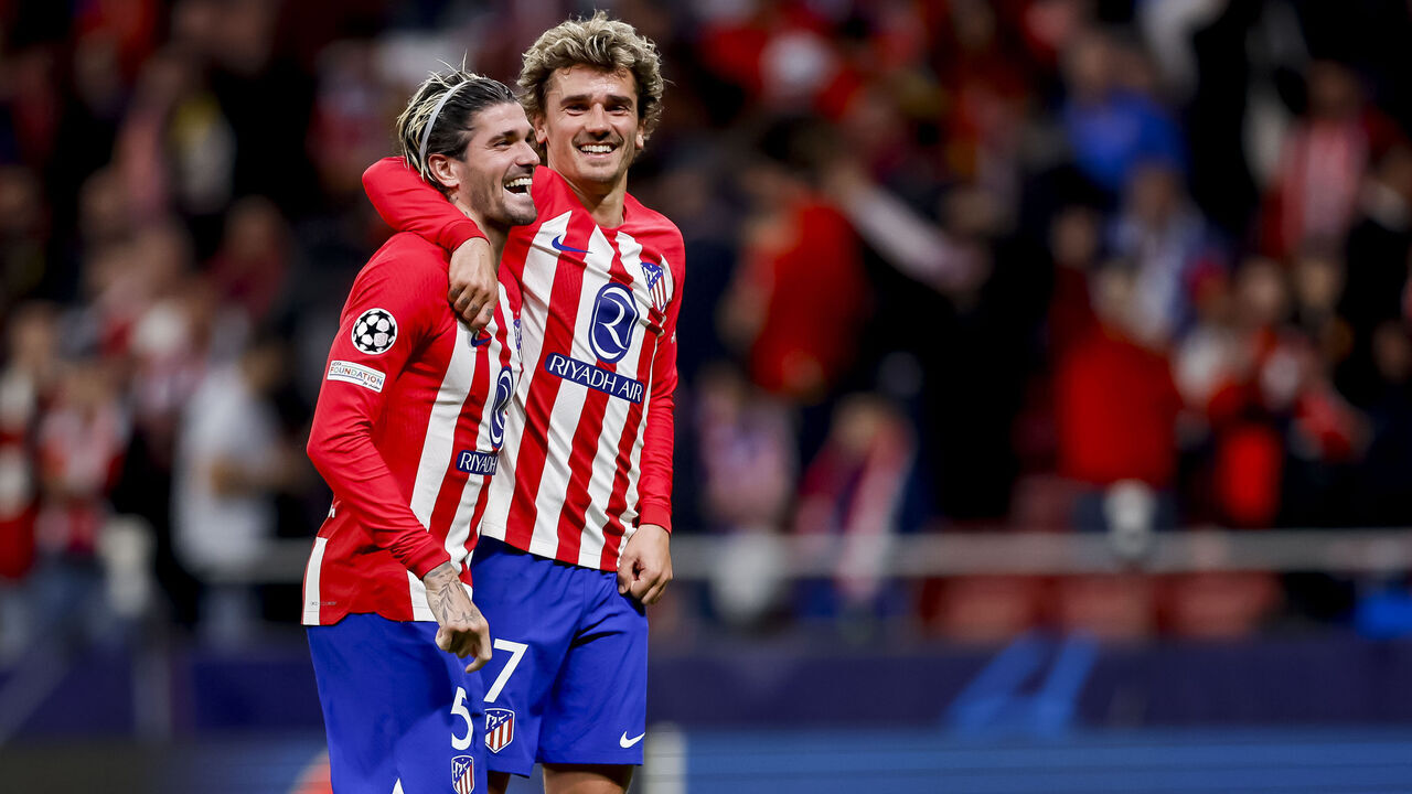 MADRID, SPAIN - APRIL 10: Rodrigo De Paul of Atletico Madrid and Antoine Griezmann of Atletico Madrid celebrate after winning the UEFA Champions League quarter-final first leg match between Atletico Madrid and Borussia Dortmund at Civitas Metropolitano Stadium on April 10, 2024 in Madrid, Spain.