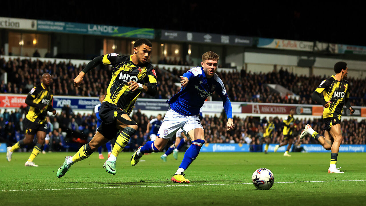 IPSWICH, ENGLAND - APRIL 10: Leif Davis of Ipswich Town and Ryan Andrews of Watford battle for possession during the Sky Bet Championship match between Ipswich Town and Watford at Portman Road on April 10, 2024 in Ipswich, England.