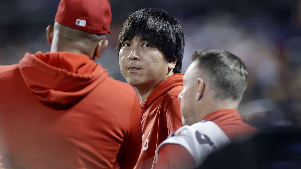 NEW YORK, NEW YORK - AUGUST 25: Interpreter Ippei Mizuhara of the Los Angeles Angels looks on against the New York Mets at Citi Field on August 25, 2023 in New York City. The Angels defeated the Mets 3-1.