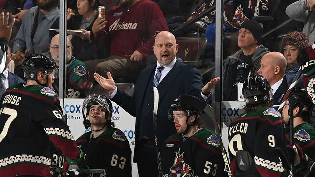 TEMPE, ARIZONA - JANUARY 02: Arizona Coyotes Head Coach Andre Tourigny talks with Clayton Keller #9 during the first period of the game against the Florida Panthers at Mullett Arena on January 02, 2024 in Tempe, Arizona.