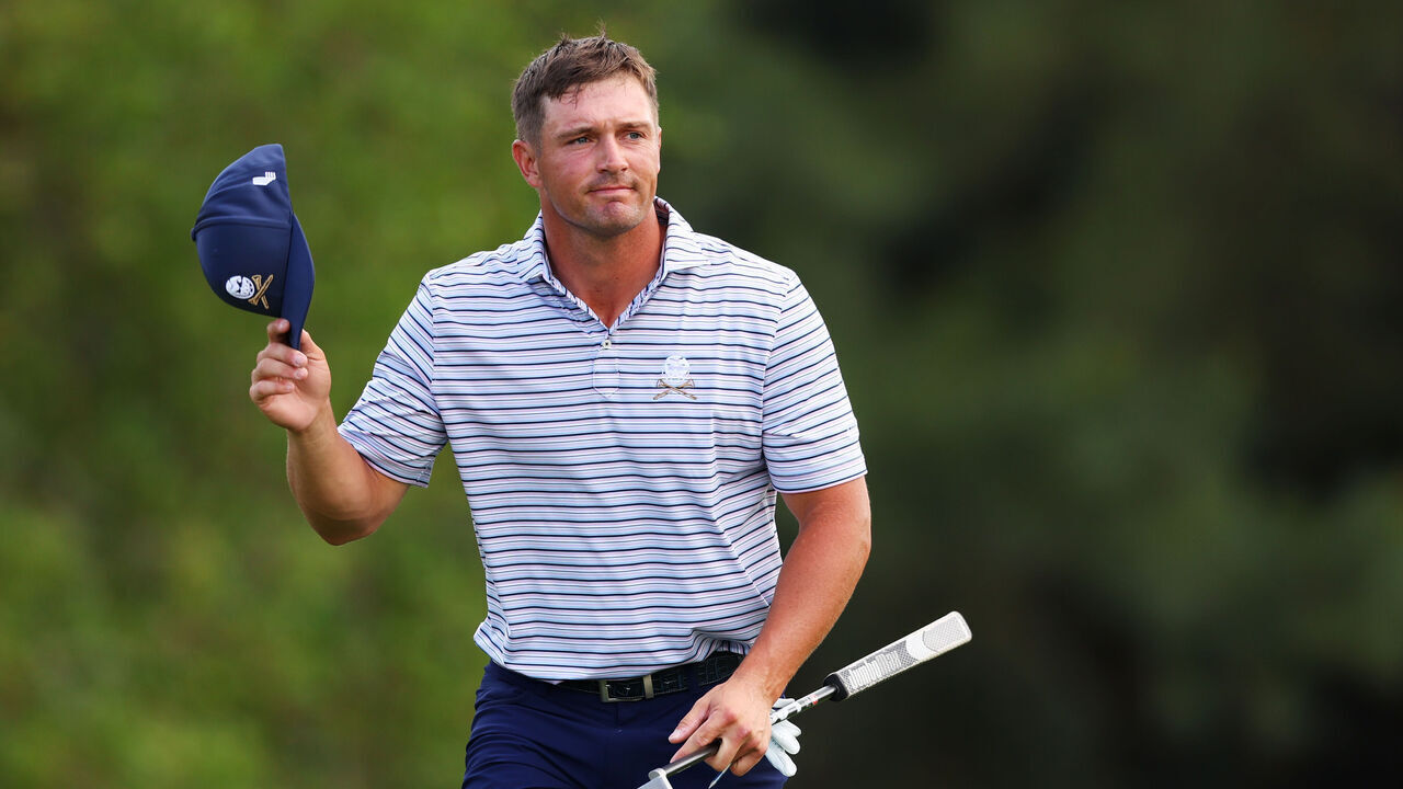 AUGUSTA, GEORGIA - APRIL 11: Bryson DeChambeau of the United States waves to the patrons on the 18th green during the first round of the 2024 Masters Tournament at Augusta National Golf Club on April 11, 2024 in Augusta, Georgia.