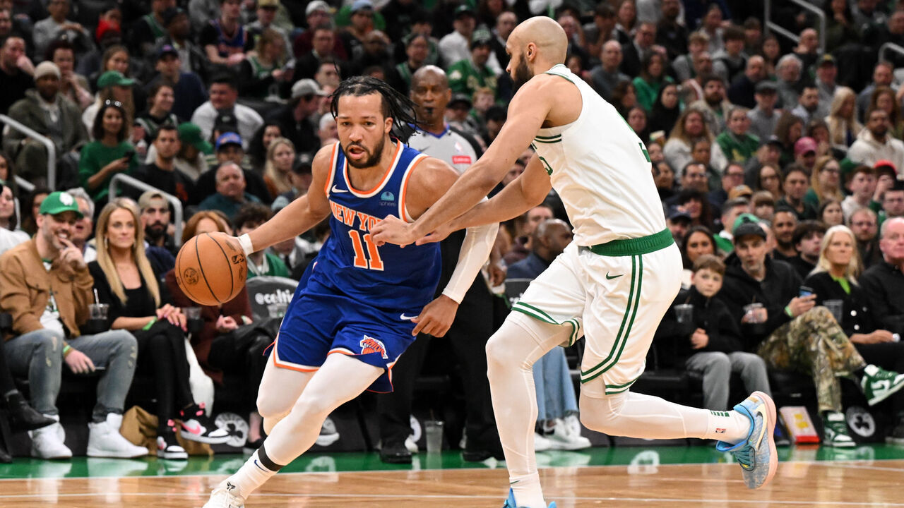 BOSTON, MASSACHUSETTS - APRIL 11: Jalen Brunson #11 of the New York Knicks drives to the basket against Derrick White #9 of the Boston Celtics during the second quarter at the TD Garden on April 11, 2024 in Boston, Massachusetts.