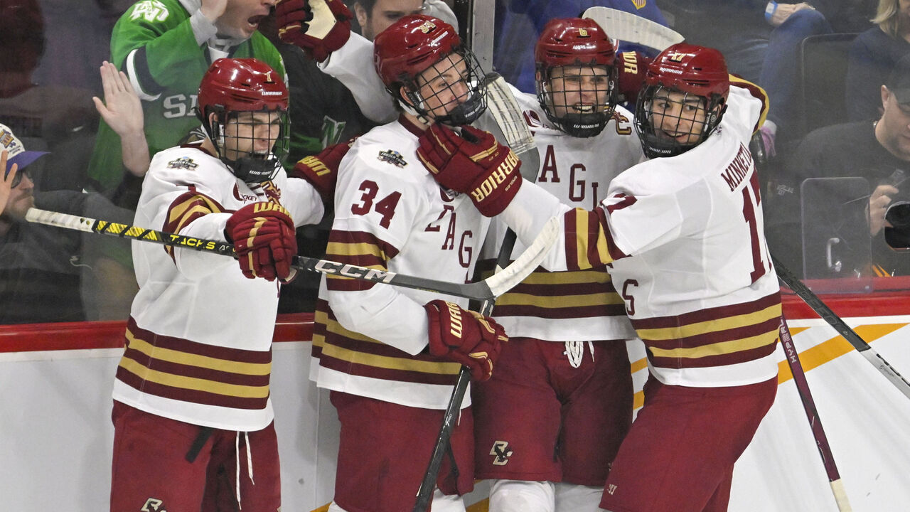 ST. PAUL, MN - APRIL 11: Boston College Eagles forward Will Smith (6) celebrates his goal with Boston College Eagles defenseman Aidan Hreschuk (7), Boston College Eagles forward Gabe Perreault (34), and Boston College Eagles defenseman Aram Minnetian (17) during the first period of a Division I Mens Ice Hockey Semifinal between the Boston College Eagles and Michigan Wolverines on April 11, 2024 at the Xcel Energy Center in St. Paul, MN.