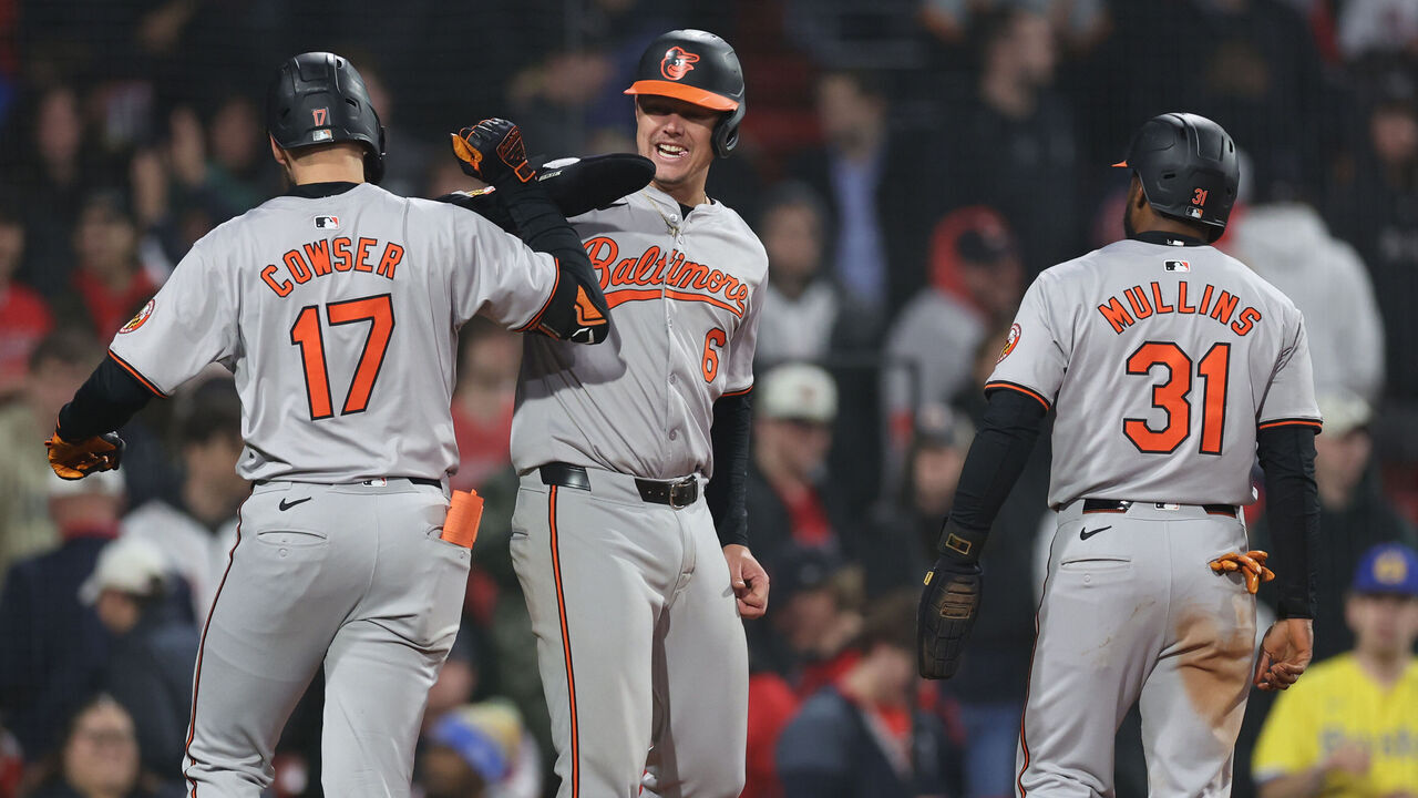 BOSTON, MASSACHUSETTS - APRIL 11: Colton Cowser #17 and Ryan Mountcastle #6 of the Baltimore Orioles celebrate after a two run home run by Cowser during the tenth inning against the Boston Red Sox at Fenway Park on April 11, 2024 in Boston, Massachusetts.