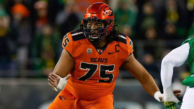 EUGENE, OREGON - NOVEMBER 24: Taliese Fuaga #75 of the Oregon State Beavers blocks during a game against the Oregon Ducks at Autzen Stadium on November 24, 2023 in Eugene, Oregon.