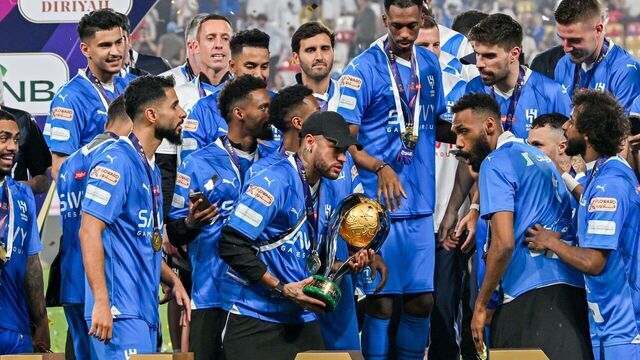 ABU DHABI, UNITED ARAB EMIRATES - APRIL 11: Players of Al Hilal celebrate victory, championship at the end of the Saudi Super Cup Final match between Al Hilal and Al Ittihad at Mohammed bin Zayed Stadium in Abu Dhabi, United Arab Emirates on April 11, 2024. The Al Hilal team clinched the trophy by defeating Al Ittihad 4-1. Players and coaching staff lifted the cup.