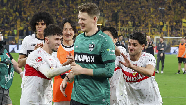 DORTMUND, GERMANY - APRIL 6: Goalkeeper Alexander Nuebel of VfB Stuttgart cheers with his teammates after the Bundesliga match between Borussia Dortmund and VfB Stuttgart at Signal Iduna Park on April 6, 2024 in Dortmund, Germany.