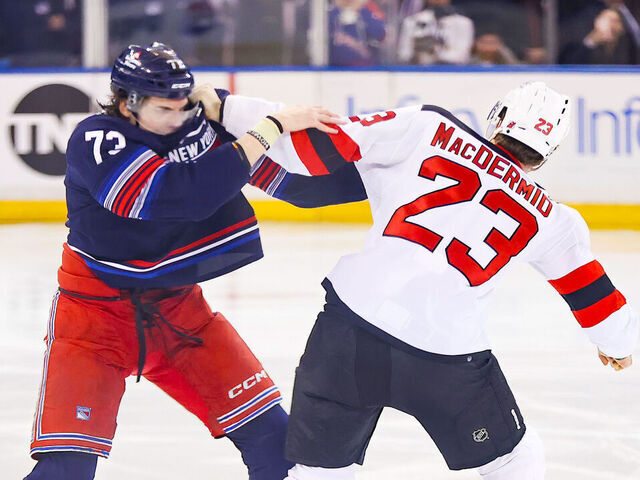 NEW YORK, NY - APRIL 03: New York Rangers Right Wing Matt Rempe (73) and New Jersey Devils Winger Kurtis MacDermid (23) fight prior to the National Hockey League game between the New Jersey Devils and the New York Rangers on April 4, 2024 at Madison Square Garden in New York, NY.