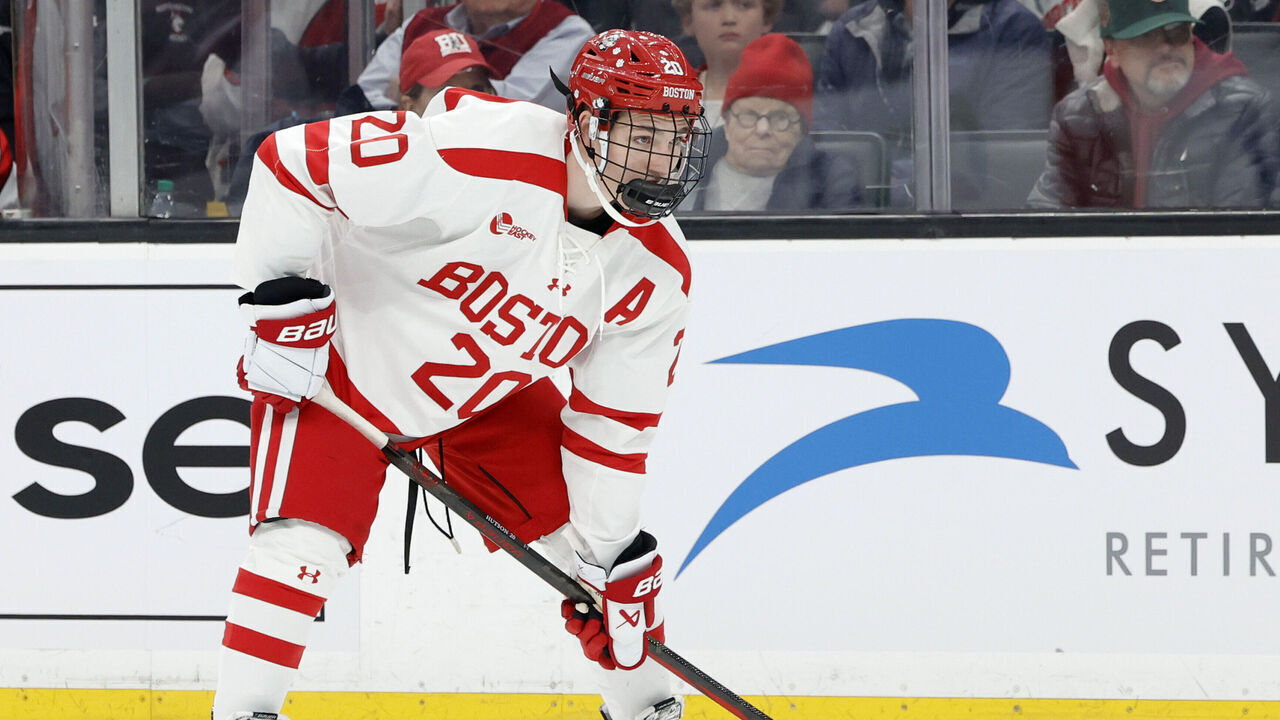 BOSTON, MA - FEBRUARY 12: Boston University defenseman Lane Hutson (20) eyes a face off during the Beanpot Championship game between Boston University and Northeastern on February 12, 2024, at TD Garden in Boston, Massachusetts.