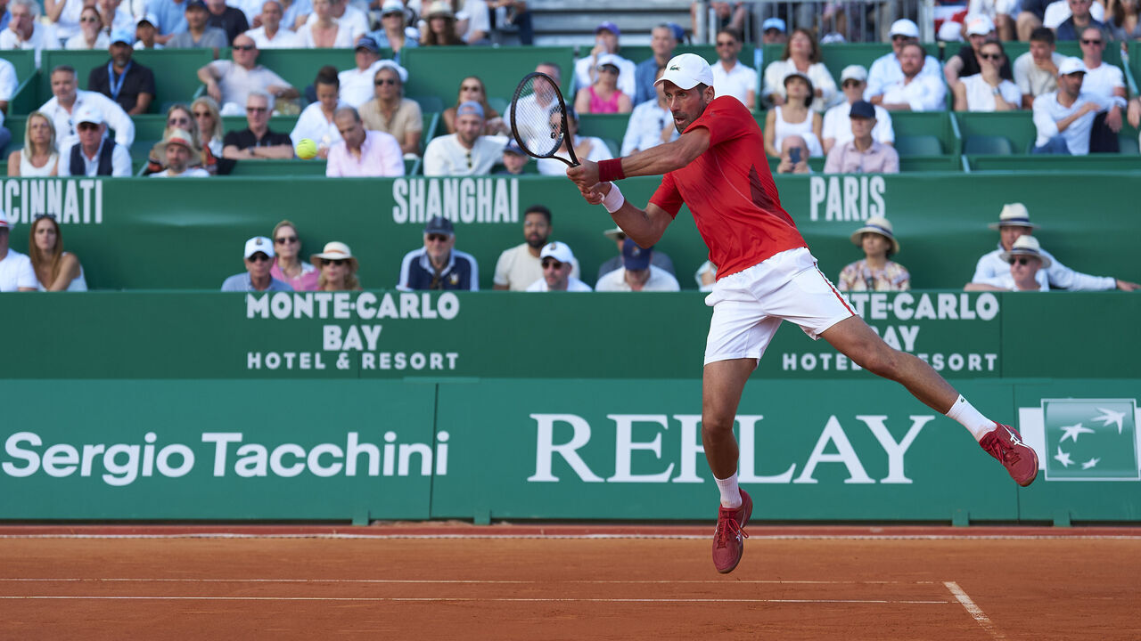 MONTE-CARLO, MONACO - APRIL 12: Novak Djokovic of Serbia plays a backhand against Alex De Minaur of Australia in their quarter-final match on day six of the Rolex Monte-Carlo Masters at Monte-Carlo Country Club on April 12, 2024 in Monte-Carlo, Monaco.