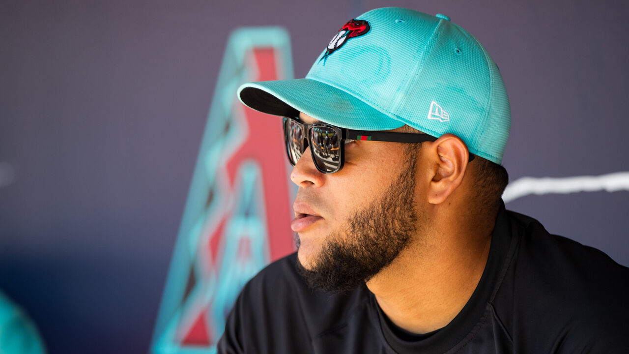 SCOTTSDALE, ARIZONA - MARCH 13: Eduardo Rodriguez #57 of the Arizona Diamondbacks sits in the dugout during the Spring Training game against the Colorado Rockies at Salt River Fields at Talking Stick on March 13, 2024 in Scottsdale, Arizona.