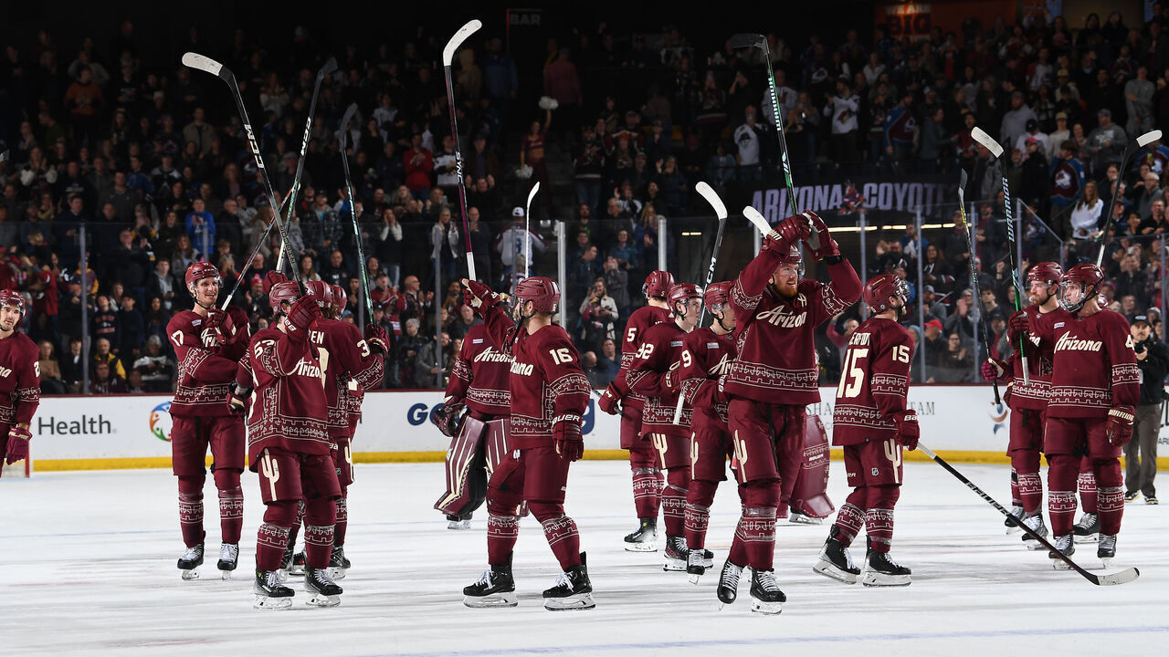 TEMPE, ARIZONA - DECEMBER 27: The Arizona Coyotes salute the crowd after an overtime win against the Colorado Avalanche at Mullett Arena on December 27, 2023 in Tempe, Arizona.