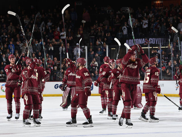 TEMPE, ARIZONA - DECEMBER 27: The Arizona Coyotes salute the crowd after an overtime win against the Colorado Avalanche at Mullett Arena on December 27, 2023 in Tempe, Arizona.