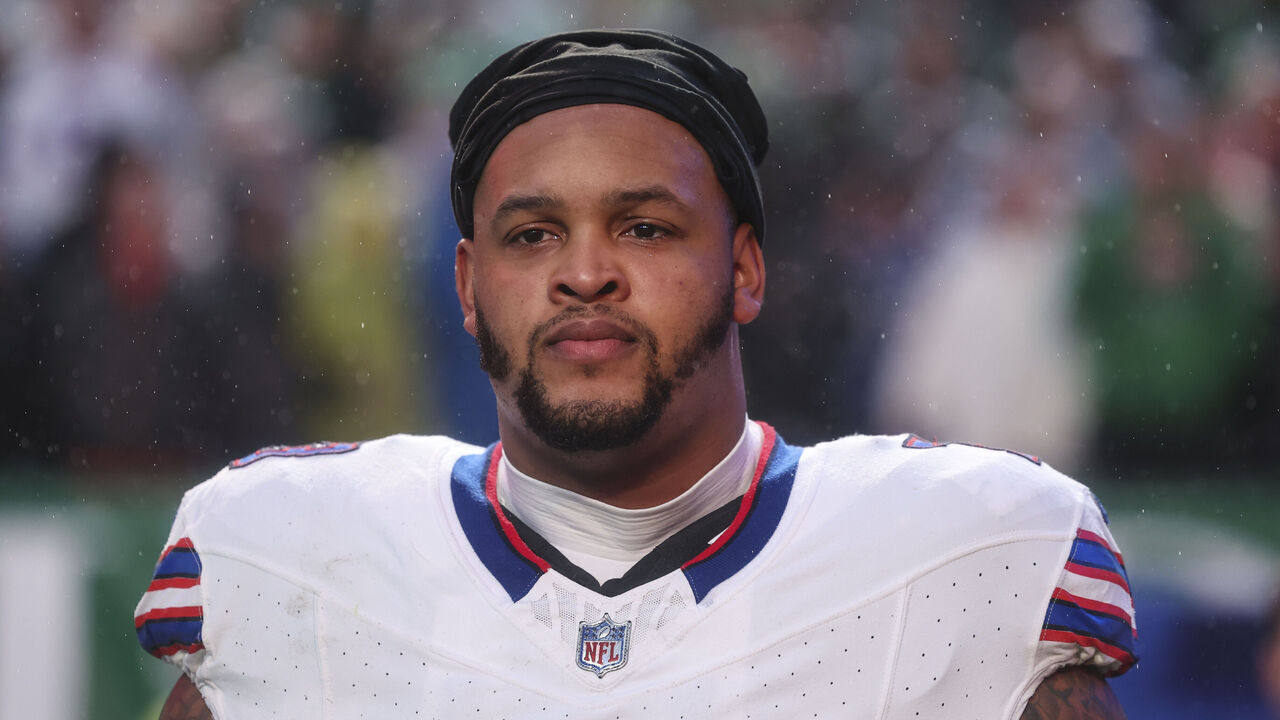 PHILADELPHIA, PA - NOVEMBER 26: Dion Dawkins #73 of the Buffalo Bills looks on from the sideline during the national anthem prior to an NFL football game against the Philadelphia Eagles at Lincoln Financial Field on November 26, 2023 in Philadelphia, Pennsylvania.
