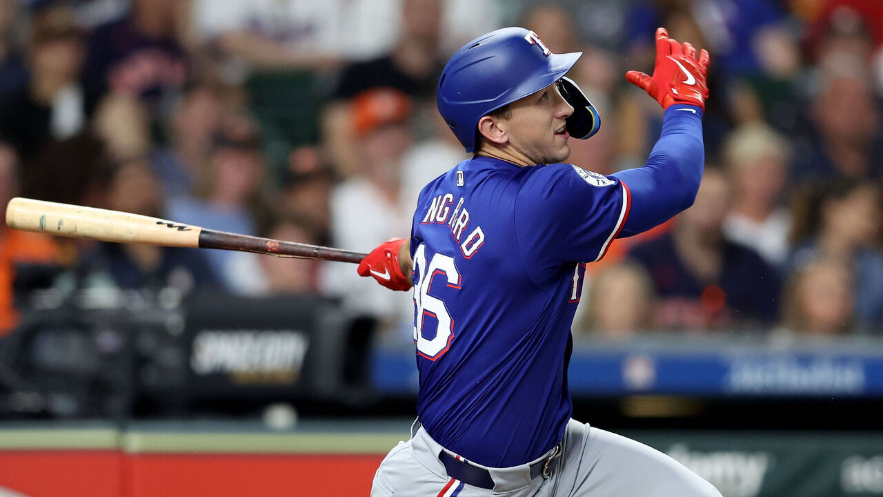 HOUSTON, TEXAS - APRIL 12: Wyatt Langford #36 of the Texas Rangers hits a two RBI single in the third inning against the Houston Astros at Minute Maid Park on April 12, 2024 in Houston, Texas.