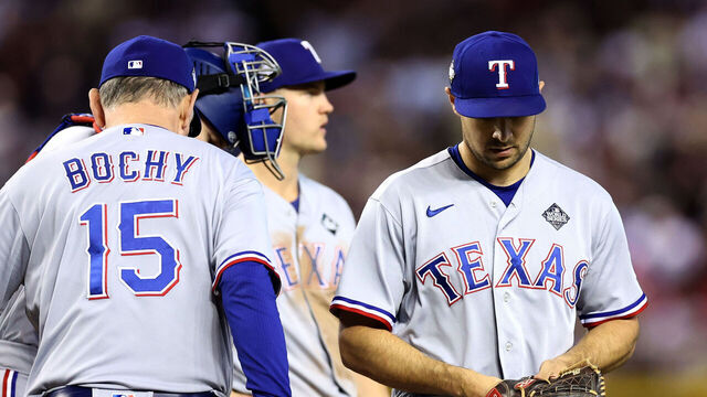 PHOENIX, ARIZONA - OCTOBER 31: Manager Bruce Bochy of the Texas Rangers relieves Brock Burke #46 in the eighth inning against the Arizona Diamondbacks during Game Four of the World Series at Chase Field on October 31, 2023 in Phoenix, Arizona.