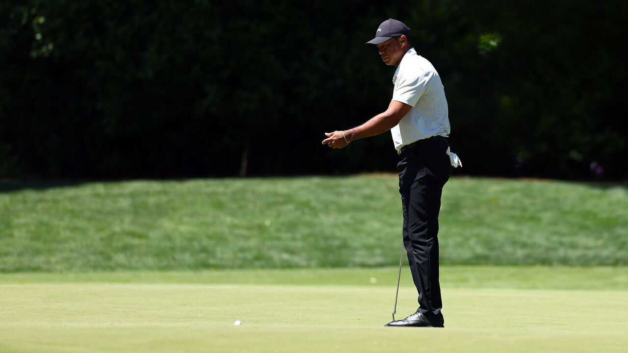 AUGUSTA, GEORGIA - APRIL 13: Tiger Woods of the United States reacts after missing a putt on the fourth green during the third round of the 2024 Masters Tournament at Augusta National Golf Club on April 13, 2024 in Augusta, Georgia.