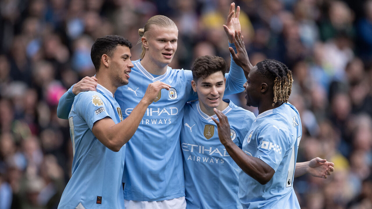 MANCHESTER, ENGLAND - APRIL 13: Matheus Nunes, Erling Haaland, Julian Alvarez and Jeremy Doku of Manchester City celebrate the first goal during the Premier League match between Manchester City and Luton Town at Etihad Stadium on April 13, 2024 in Manchester, England.