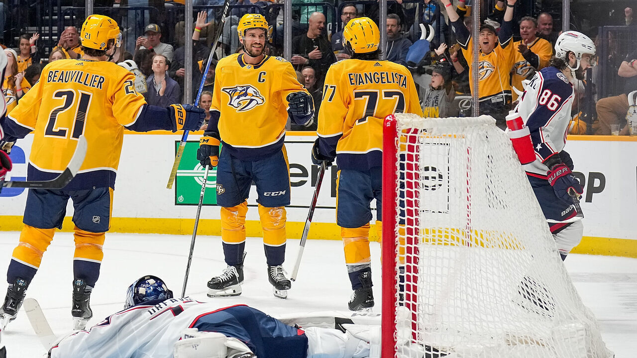 NASHVILLE, TENNESSEE - APRIL 13: Roman Josi #59 celebrates his goal with Luke Evangelista #77 and Anthony Beauvillier #21 of the Nashville Predators against Jet Greaves #73 of the Columbus Blue Jackets during an NHL game at Bridgestone Arena on April 13, 2024 in Nashville, Tennessee.