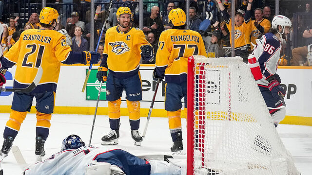NASHVILLE, TENNESSEE - APRIL 13: Roman Josi #59 celebrates his goal with Luke Evangelista #77 and Anthony Beauvillier #21 of the Nashville Predators against Jet Greaves #73 of the Columbus Blue Jackets during an NHL game at Bridgestone Arena on April 13, 2024 in Nashville, Tennessee.