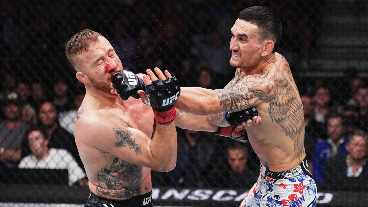 LAS VEGAS, NEVADA - APRIL 13: (R-L) Max Holloway punches Justin Gaethje in a lightweight fight during the UFC 300 event at T-Mobile Arena on April 13, 2024 in Las Vegas, Nevada.