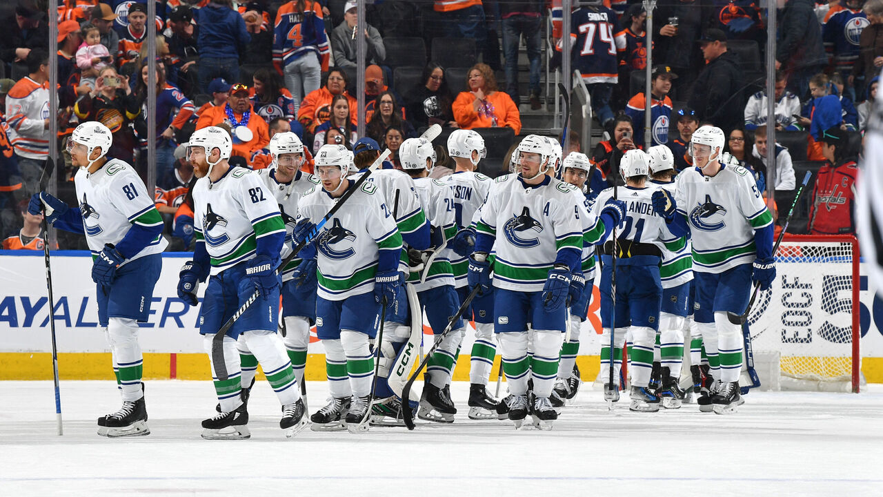 EDMONTON, CANADA - APRIL 13: The Vancouver Canucks celebrate their win over the Edmonton Oilers after the game at Rogers Place on April 13, 2024, in Edmonton, Alberta, Canada.