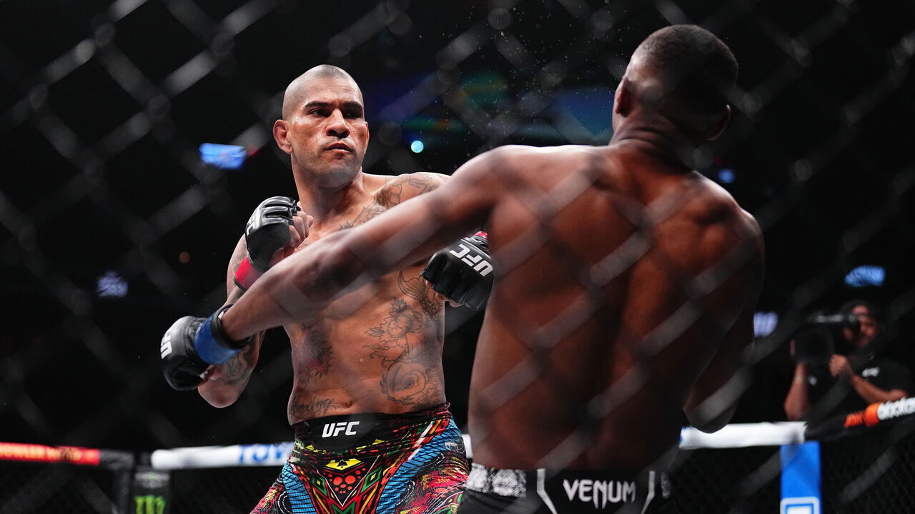 LAS VEGAS, NEVADA - APRIL 13: (L-R) Alex Pereira of Brazil punches Jamahal Hill in the UFC light heavyweight championship fight during the UFC 300 event at T-Mobile Arena on April 13, 2024 in Las Vegas, Nevada.