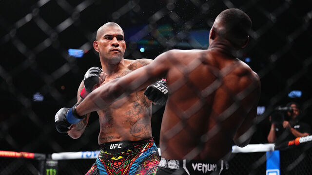 LAS VEGAS, NEVADA - APRIL 13: (L-R) Alex Pereira of Brazil punches Jamahal Hill in the UFC light heavyweight championship fight during the UFC 300 event at T-Mobile Arena on April 13, 2024 in Las Vegas, Nevada.