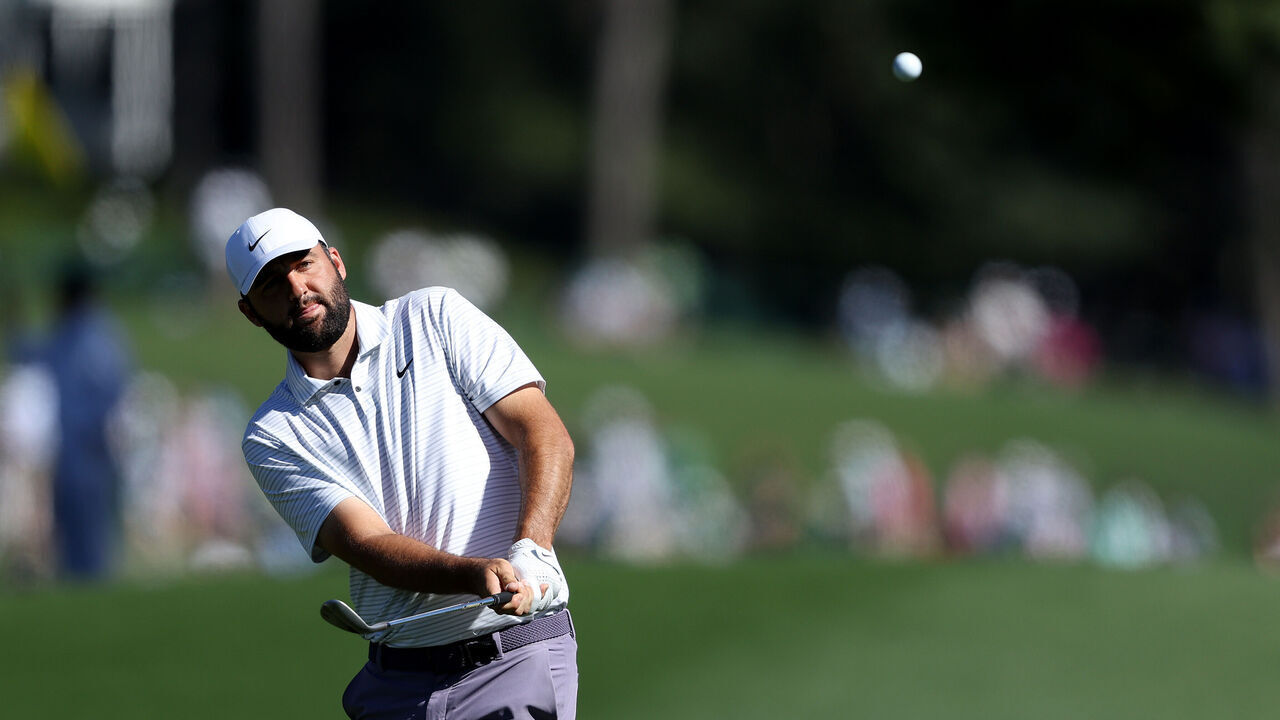 AUGUSTA, GEORGIA - APRIL 13: Scottie Scheffler of the United States plays his shot on the eighth hole during the third round of the 2024 Masters Tournament at Augusta National Golf Club on April 13, 2024 in Augusta, Georgia.