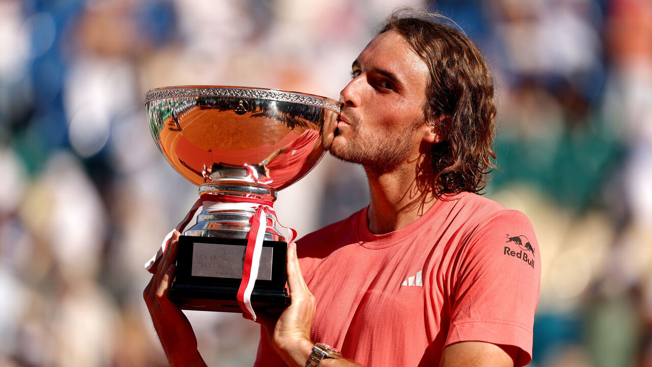 MONTE-CARLO, MONACO - APRIL 14: Stefanos Tsitsipas of Greece poses for a photograph as he kisses the trophy after his victory over Casper Ruud of Norway in the Men's Double's Final on day eight of the Rolex Monte-Carlo Masters at Monte-Carlo Country Club on April 14, 2024 in Monte-Carlo, Monaco.