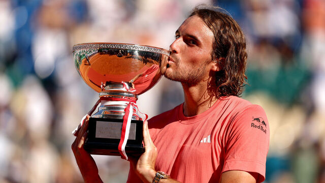 MONTE-CARLO, MONACO - APRIL 14: Stefanos Tsitsipas of Greece poses for a photograph as he kisses the trophy after his victory over Casper Ruud of Norway in the Men's Double's Final on day eight of the Rolex Monte-Carlo Masters at Monte-Carlo Country Club on April 14, 2024 in Monte-Carlo, Monaco.