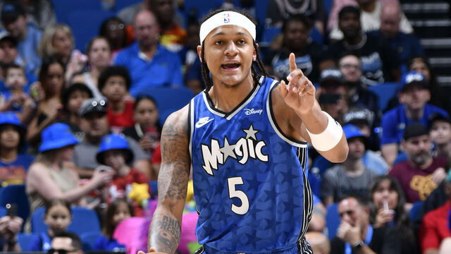 ORLANDO, FL - APRIL 14: Paolo Banchero #5 of the Orlando Magic handles the ball during the game against the Milwaukee Bucks on April 14, 2024 at Kia Center in Orlando, Florida. Mandatory Copyright Notice: Copyright 2024 NBAE