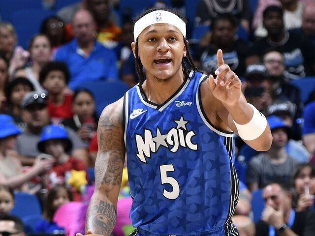 ORLANDO, FL - APRIL 14: Paolo Banchero #5 of the Orlando Magic handles the ball during the game against the Milwaukee Bucks on April 14, 2024 at Kia Center in Orlando, Florida. Mandatory Copyright Notice: Copyright 2024 NBAE