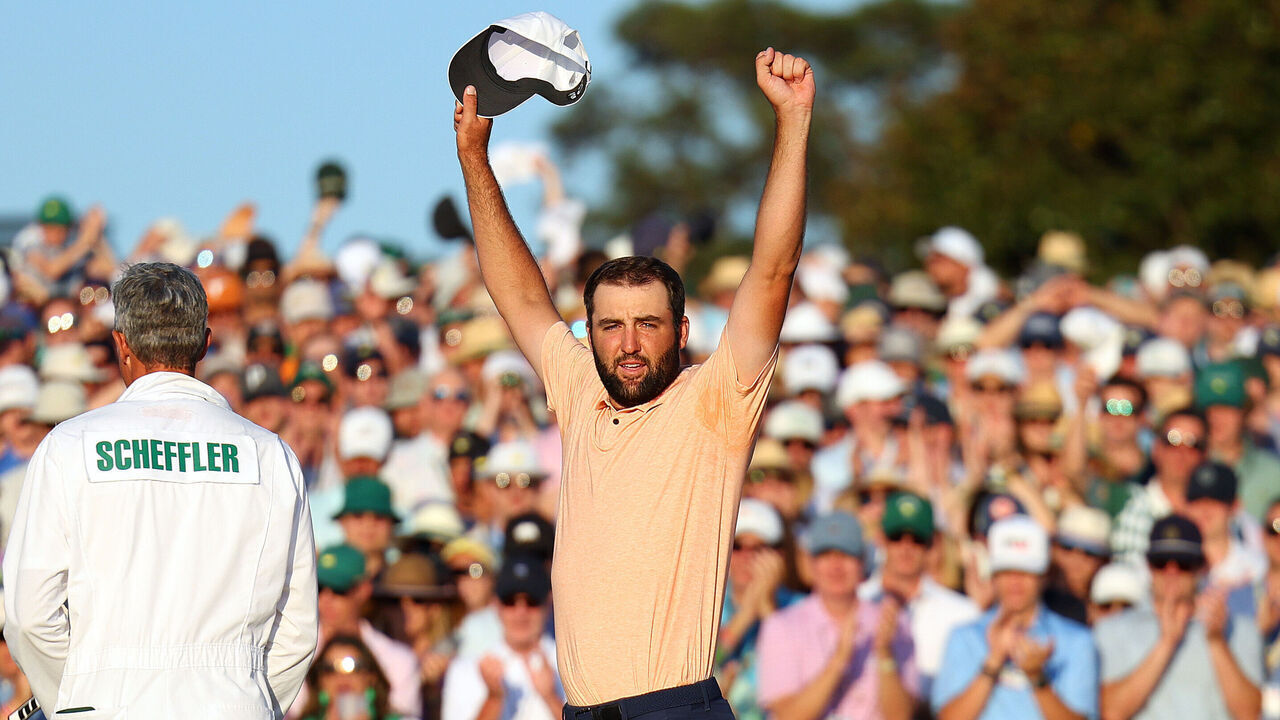 AUGUSTA, GEORGIA - APRIL 14: Scottie Scheffler of the United States celebrates on the 18th green after winning the 2024 Masters Tournament at Augusta National Golf Club on April 14, 2024 in Augusta, Georgia.
