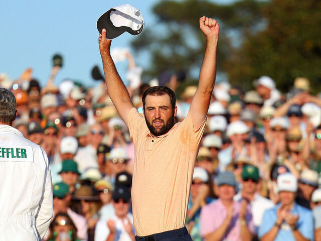 AUGUSTA, GEORGIA - APRIL 14: Scottie Scheffler of the United States celebrates on the 18th green after winning the 2024 Masters Tournament at Augusta National Golf Club on April 14, 2024 in Augusta, Georgia.