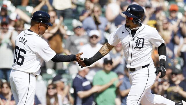 DETROIT, MI - APRIL 14: Javier Báez #28 of the Detroit Tigers celebrates with third base coach Joey Cora #56 of the Detroit Tigers after hitting a solo home run against the Minnesota Twins during the eighth inning at Comerica Park on April 14, 2024 in Detroit, Michigan.